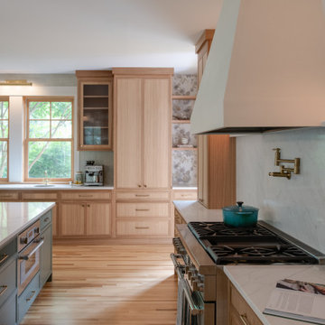Warm Modern Kitchen Renovation with Natural Oak & Green Accents