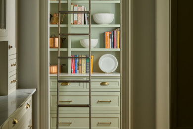 Inspiration for a mid-sized french country galley medium tone wood floor and brown floor eat-in kitchen remodel in Baltimore with a farmhouse sink, shaker cabinets, white cabinets, marble countertops, multicolored backsplash, marble backsplash, black appliances, an island and multicolored countertops
