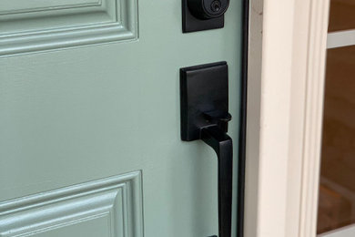 Entryway - contemporary entryway idea in Charlotte with a green front door
