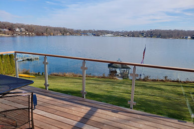 Inspiration for a mid-sized modern backyard deck remodel in New York with no cover