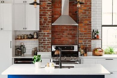 Kitchen - mid-sized transitional dark wood floor and brown floor kitchen idea in Other with an undermount sink, shaker cabinets, quartz countertops, white backsplash, subway tile backsplash, stainless steel appliances, an island, white countertops and white cabinets