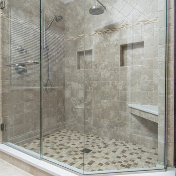 Full Length Glass Walls with Dual Rain Shower Fixtures and Built-In Shower Bench