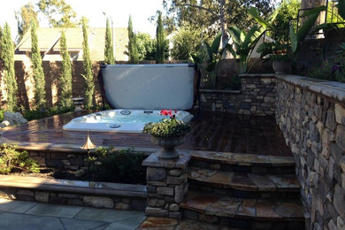 Inspiration for a small traditional drought-tolerant and partial sun backyard landscaping in Orange County with decking.