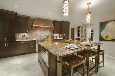 Enclosed kitchen - large traditional l-shaped porcelain tile enclosed kitchen idea in Other with mosaic tile backsplash, granite countertops, an island, paneled appliances, an undermount sink, recessed-panel cabinets, dark wood cabinets and brown backsplash