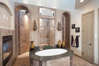 Example of a transitional glass tile porcelain tile doorless shower design in Other with an undermount tub and beige walls