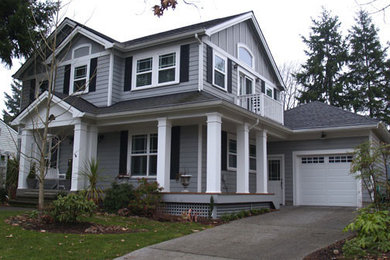 Large trendy front porch photo in Other with a roof extension