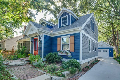 Blue two-story exterior home idea in Other with a shingle roof