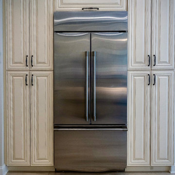 Built-in Sub-Zero Refrigerator with Creamy Yellow Cabinetry