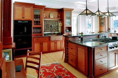 This is an example of a mid-sized arts and crafts kitchen in Seattle.