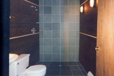 Inspiration for a small timeless gray tile slate floor walk-in shower remodel in New York with a pedestal sink, light wood cabinets, a two-piece toilet and brown walls