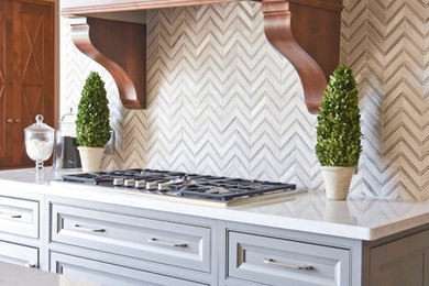 Traditional kitchen in Houston with beaded inset cabinets, grey cabinets, quartz benchtops, grey splashback and mosaic tile splashback.