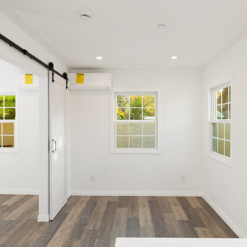 Space-Saving Barn Door and Split-Unit AC in Modern ADU