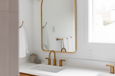Inspiration for a transitional kids' white tile and ceramic tile limestone floor, beige floor and double-sink bathroom remodel in Seattle with beaded inset cabinets, medium tone wood cabinets, a bidet, yellow walls, an undermount sink, quartz countertops, white countertops, a niche and a built-in vanity