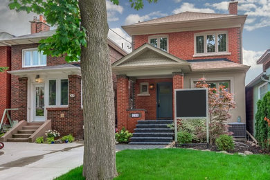 Transitional exterior home idea in Toronto