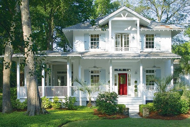 Mid-sized traditional white two-story wood exterior home idea in Calgary with a shingle roof