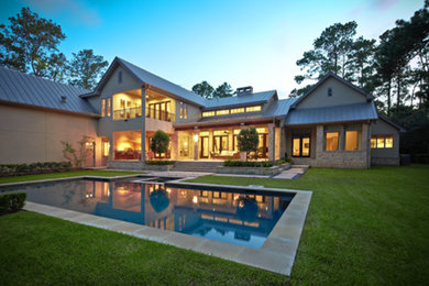Example of a large transitional backyard concrete paver and rectangular lap hot tub design in Houston