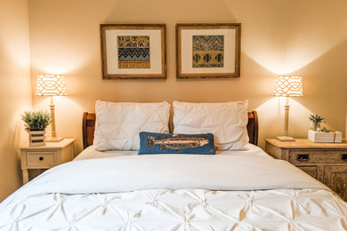 Inspiration for a small transitional guest carpeted and beige floor bedroom remodel in New York with beige walls
