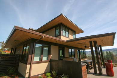 Inspiration for a large transitional beige two-story stucco exterior home remodel in Other