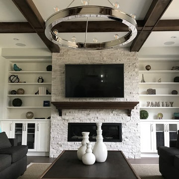 Home theater in rustic modern Rec Room with built-in cabinetry