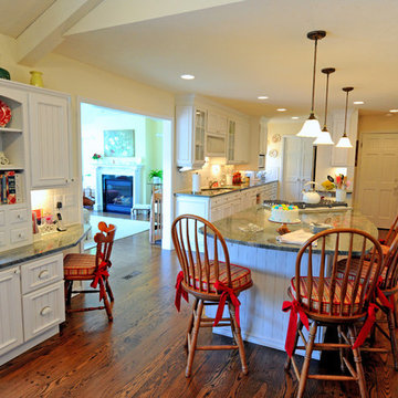 Galley kitchen & family room transformed into a large eat-in kitchen and dining