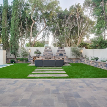 Backyard Remodel with Pavers, Fireplace, Artificial Grass, Walls, Lighting