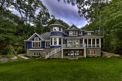 Mid-sized victorian blue three-story wood exterior home idea in Other with a hip roof