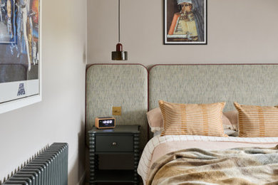 Example of a large transitional bedroom design in London