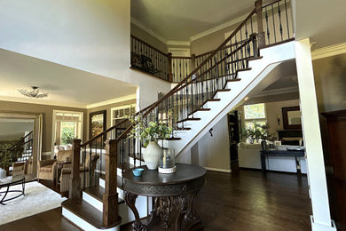 Staircase - mid-sized traditional wooden curved mixed material railing staircase idea in DC Metro with painted risers