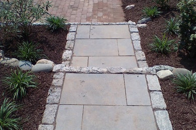 Inspiration for a small timeless backyard brick patio remodel in Philadelphia