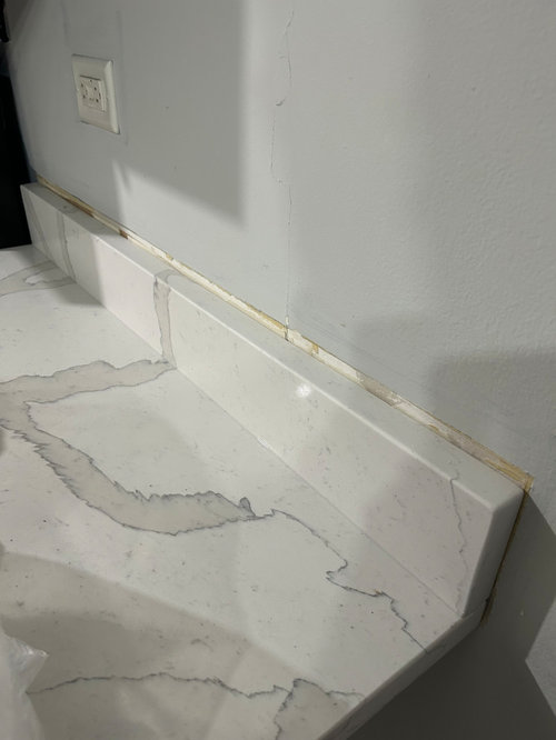 Drywall damaged during kitchen countertop installation. Help!