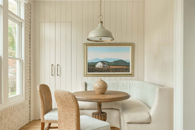 Transitional medium tone wood floor, brown floor, shiplap ceiling and shiplap wall dining room photo in Raleigh with beige walls