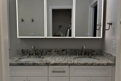 Inspiration for a mid-sized transitional master double-sink bathroom remodel in Atlanta with shaker cabinets, white cabinets, granite countertops and a built-in vanity