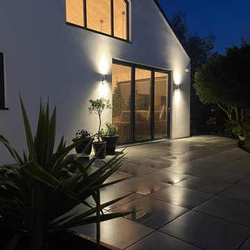 Wall Lights Washing Down a Porcelain Terrace at Night