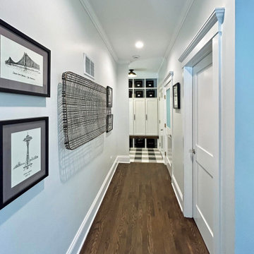 Heritage Reimagined: Hallway with Crown Molding and Art Display
