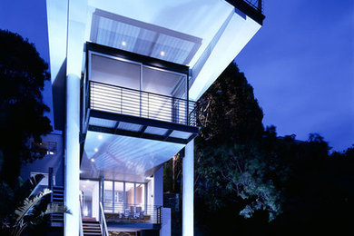 Inspiration for a large modern three-storey exterior in Sydney.