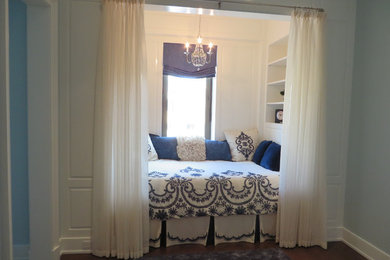 Blue and White Bedroom Nook with a Roman Shade and Sheers