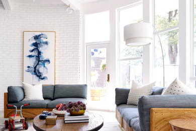 This is an example of a contemporary living room in Dallas with white walls.