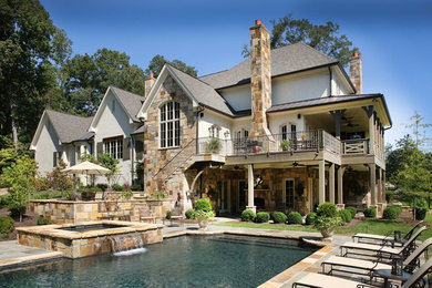 Inspiration for a large craftsman backyard patio remodel in Other with a fire pit and a roof extension