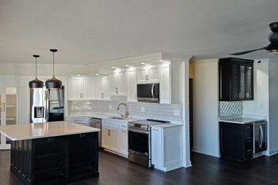 Inspiration for a mid-sized contemporary u-shaped kitchen pantry remodel in Other with flat-panel cabinets, white cabinets, quartz countertops, an island and white countertops