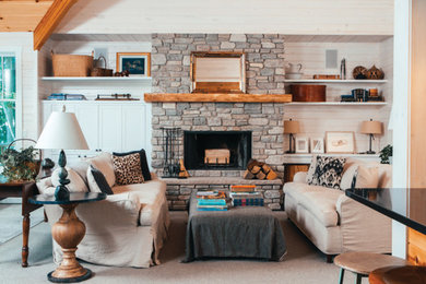 Example of a mid-sized trendy open concept carpeted living room library design in Other with white walls, a standard fireplace, a stone fireplace and no tv
