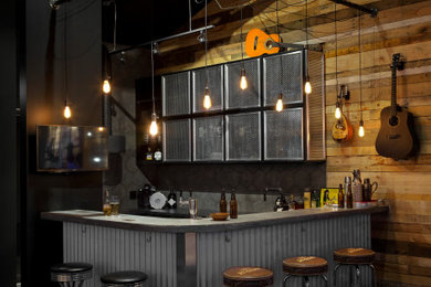 Home bar - industrial home bar idea in Vancouver