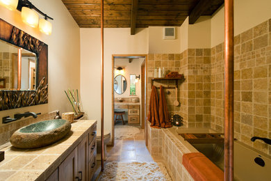 Large arts and crafts master bathroom in Seattle with a vessel sink, an alcove tub, shaker cabinets, medium wood cabinets, a two-piece toilet, beige tile, cement tile, beige walls, travertine floors, concrete benchtops and brown floor.