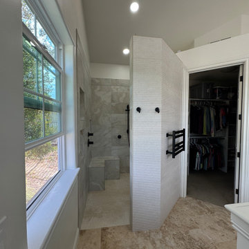 Curd-less walk-in shower; heated floors in bathroom + shower+bench LED