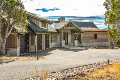 Mid-sized transitional brown two-story wood and clapboard exterior home photo in Denver with a mixed material roof and a gray roof