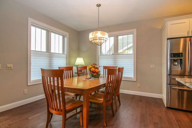 Photo of a traditional dining room in Milwaukee with medium hardwood flooring.