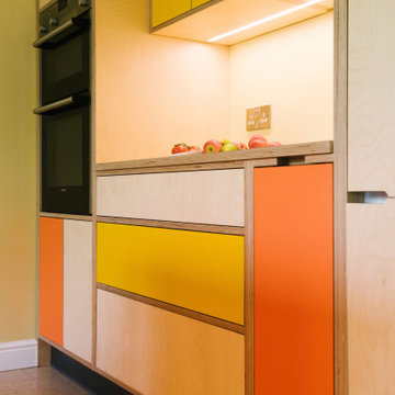 The Bradys - Orange and Yellow Plywood Kitchen