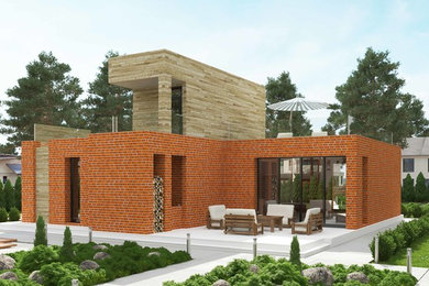 Пример оригинального дизайна: маленький, одноэтажный, красный частный загородный дом в современном стиле с комбинированной облицовкой, плоской крышей и зеленой крышей для на участке и в саду
