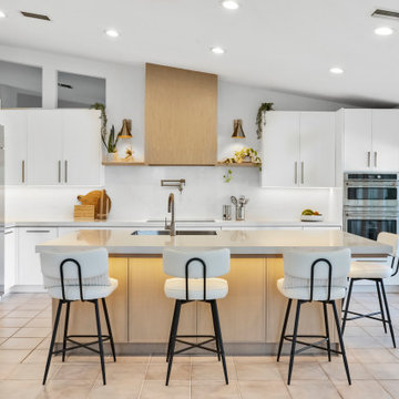 Spacious Transitional Kitchen with Island and Bar Seating in Weston