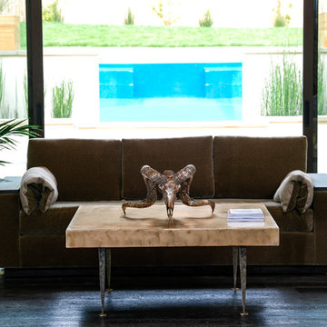 Bronze American Ram skull atop Bronze and steel coffee table