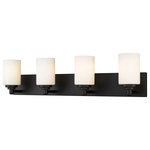 Z-Lite - Soledad Four Light Vanity, Matte Black - Let your bathroom or hallway bask in soft warm light. This contemporary four-light wall sconce has a sophisticated streamlined look and extends from a long mirrored plate for a chic contrast. From the sconce's cylindrical white etched glass shades to its matte black finish this fixture stylishly upgrades your space.